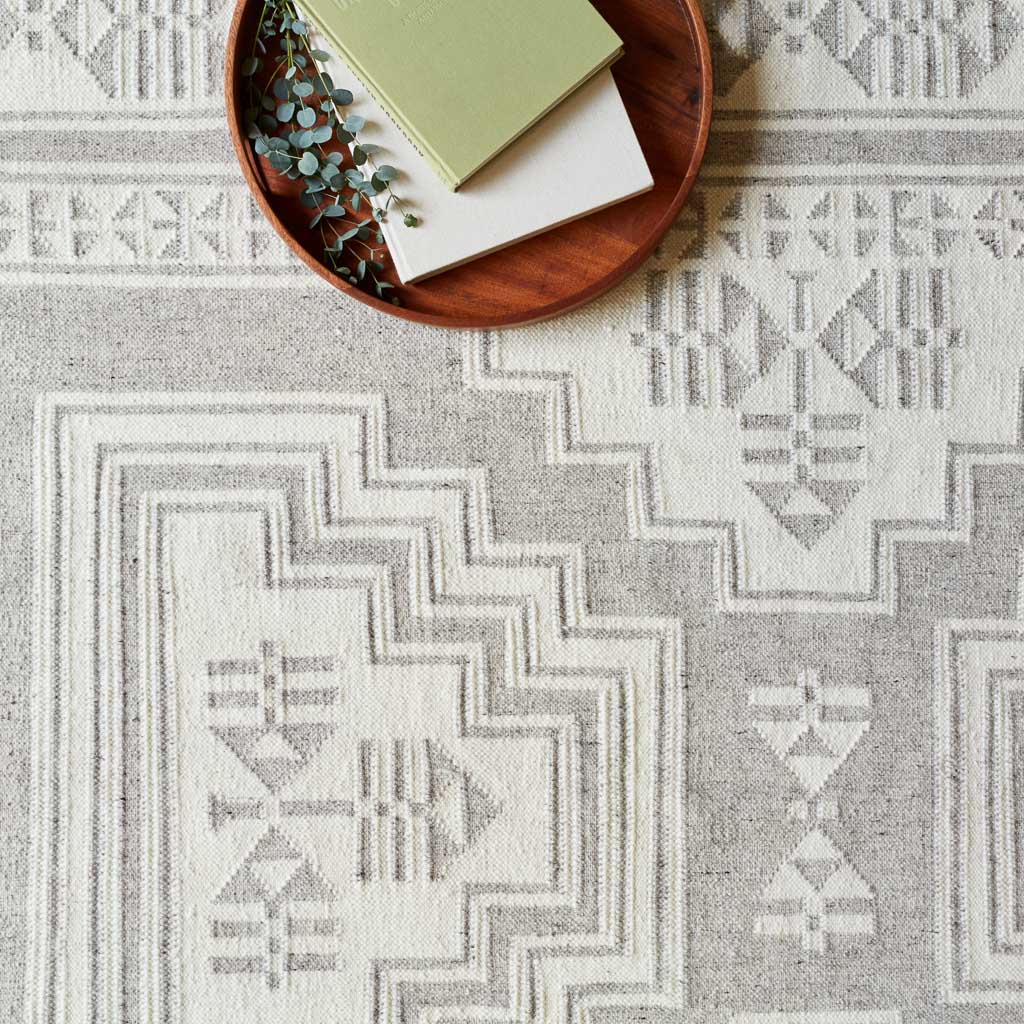 Layered Handwoven Area Rug in Sand - Image 9